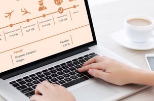 silver laptop showing the process of parcel tracking in a portal 
